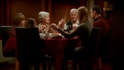 Family saying grace together at the Thanksgiving table before dinner Stock Footage