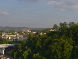 WS AERIAL View of Blue Cross Blue Shield of Tennessee office building then reveal of AT and T Field (baseball stadium) and buildings of downtown / Chattanooga, Tennessee, United States  Stock Footage