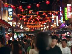 WS Chinese new year crowds shopping under chinese lanterns, chinatown Stock Footage