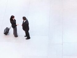  HA Business associates meet in the middle of empty white space, shake hands, and talk, before leaving separately / Seattle, Washington, United States Stock Footage