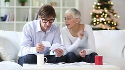 senior couple calculating domestic bills Stock Footage