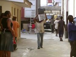 MS People Impaired TV take in store room / Lagos, Nigeria Stock Footage