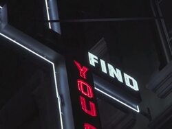 A neon cross with "You Find Out" lettering  Stock Footage