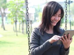 Tablet for lifestyle in playground,Bangkok Thailand Stock Footage