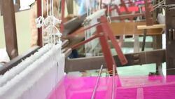 Traditional Thai silk weaving by using the loom. Stock Footage