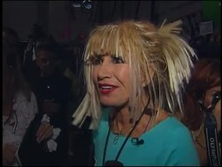 Flamboyant designer's latest show. Plus Sarah Ferguson News Clip