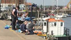 People on Wells Next To Sea dockside News Clip