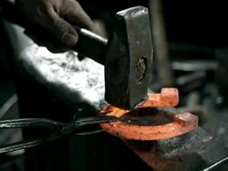 HD SLOW MOTION: Hammering A Hot Horseshoe Stock Footage