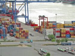 Container Cargo freight ship with working crane bridge in shipyard Stock Footage