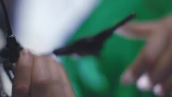 Bicycle mechanic twists 3-way hex wrench in bike repair shop Stock Footage