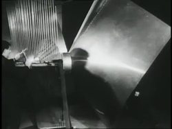 A man pushes a cart loaded with a musical instrument; musicians perform on unconventional instruments. News Clip