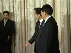 Handshake between presidents Hu and Lee News Clip