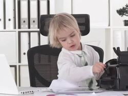 HD: Funny Little Business Boy With Multitasking Skills Stock Footage