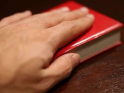 hand on a bible Stock Footage