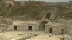 Large stones clutter the crumbling Uthina Amphitheater in Tunisia. Stock Footage