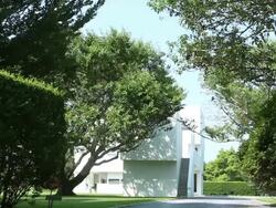 Exterior entrance to a modern white house Stock Footage