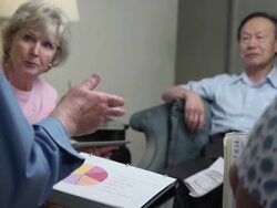 Man Discusses Financial Issues with Group of Seniors Stock Footage