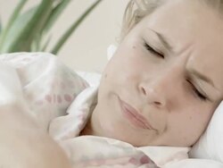 Sick Woman in Bed Blowing Nose Stock Footage