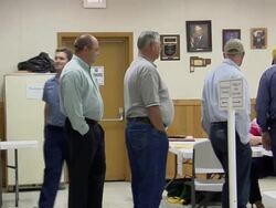 MS, PAN, People waiting in line to registration table at polling place, New Knoxville, Ohio, USA Stock Footage