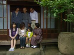 WS PORTRAIT Multigenerational family posing at entrance to house/ Tokyo, Japan Stock Footage