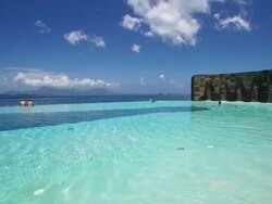 Infinity pool overlooking the ocean and Moorea Island Stock Footage