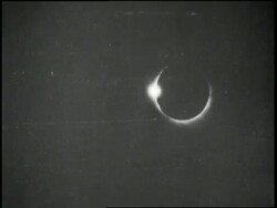 A man uses a special lens to watch a solar eclipse. News Clip