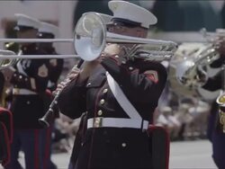 A marine marching band marches crisply along, camera follows various players. Stock Footage