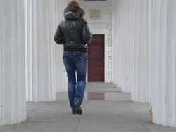 girl goes along the columns Stock Footage