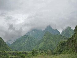 T/L clouds over wooded mountains, Tatopani Valley, Himalayas Stock Footage