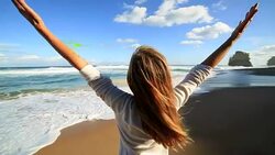 Woman relaxing on beach Stock Footage