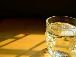 Dolly Shot: Glass of Water on the Table Stock Footage