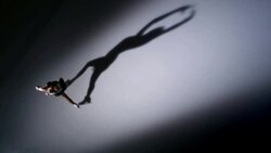 SLO MO CS Figure skater in a raised hands pose Stock Footage