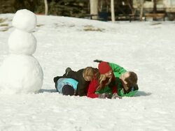 Family has a snow ball fight Stock Footage