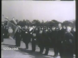 1942: JAPAN: EMPEROR HIROHITO: * WS Silhouette of Japanese gate, aka Torii. VS Emperor of Japan Hirohito (1901-1989) & officers riding on horse, large group of Japanese people standing in line bowing, Hirohito & officers on horseback, riding. WWII Instructional Video