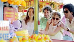 Friends winning prize at amusement park Stock Footage
