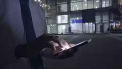 Man using mobile phone at night in the city Stock Footage