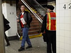 Transit worker directing customers on subway. Stock Footage