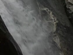 CU TD Water cascades over mountainside into pool of water at Yosemite National Park / California, United States Stock Footage