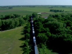 Frieght train running through the contryside Stock Footage