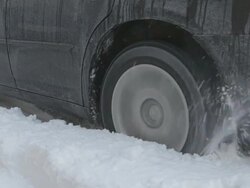 MS Tires spinning in snow Stock Footage