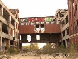 Pan of abandoned auto assembly plant Stock Footage