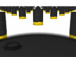 Dolly over many Oil Drums (Black and Gold) to single Drum Stock Footage