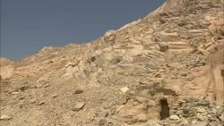 A blue sky outlines a rocky hill with an ancient emerald mine in Sikait, Egypt. Stock Footage