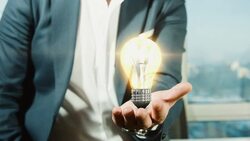 Businessman Holding Light Bulb | Idea Stock Footage