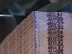 Close Up static - A machine stacks magazines in a factory /  Wisconsin, United States Stock Footage