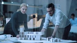 DS Female architect and colleague constructing a architectural model Stock Footage