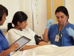 "patient in hospital having her blood pressure taken /Richmond,Virginia, USA" Stock Footage