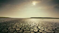 Dry, cracked earth and clouds Stock Footage