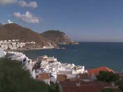 WS View of White Town at Cabo de Gata Natural Park with sea / San Jose, Andalusia, Spain Stock Footage