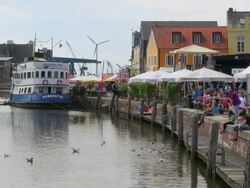 WS Shot of ferry boat on harbor and cafÃƒÂ© near harbor area, North Sea North Frisia, / Husum, Schleswig Holstein, Germany Stock Footage